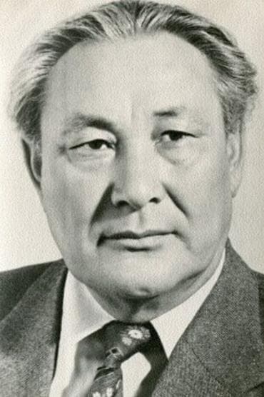 Professional headshot of Kenenbai Kozhabekov