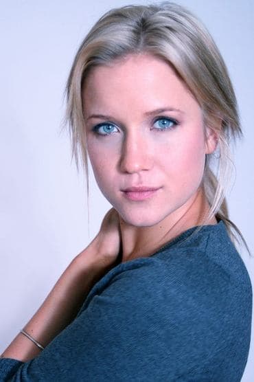 Professional headshot of Jessy Schram